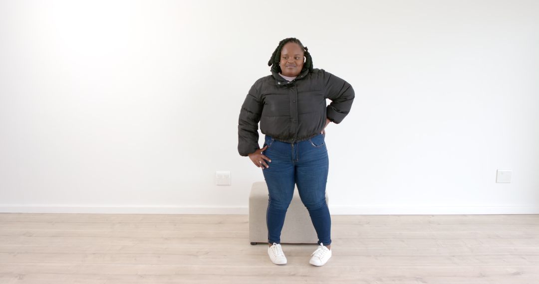 Confident Woman in Casual Outfit Inside Minimalist Room