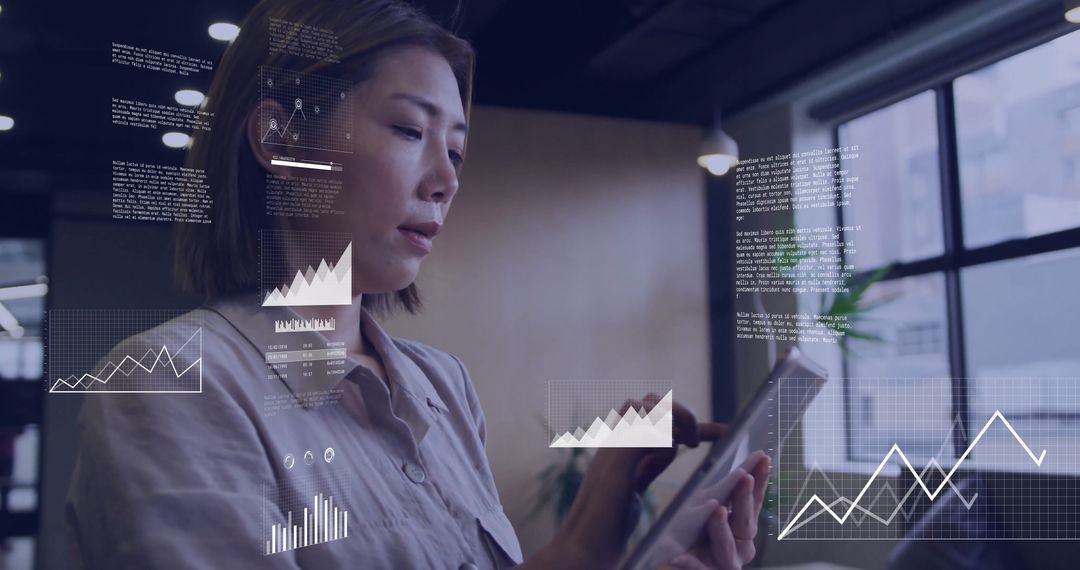 Business Professional Using Tablet with Graph Visualizations