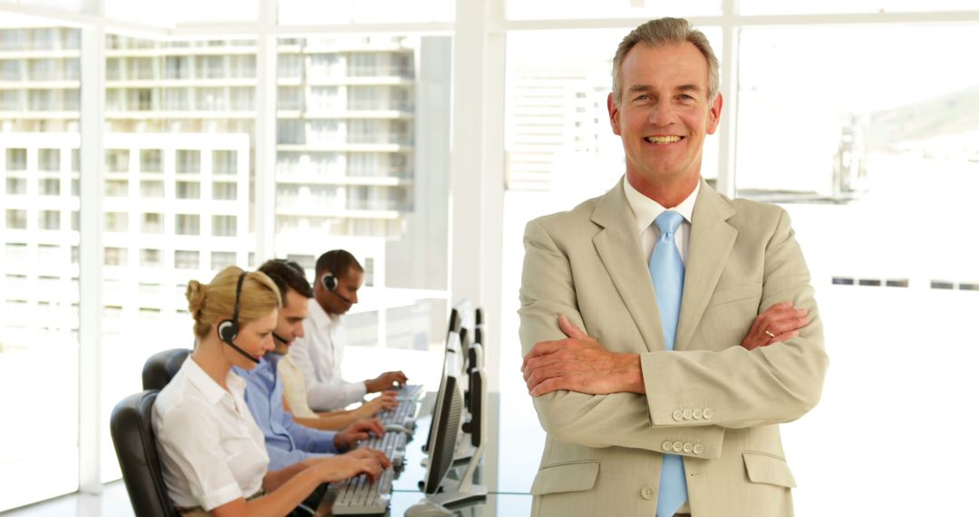 Confident Business Leader Overlooking Busy Call Center