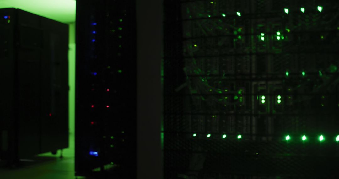 Dimly Lit Server Room with Green LED Lights and Data Racks