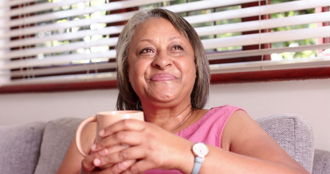 Senior Woman Relaxing at Home with Cup of Coffee