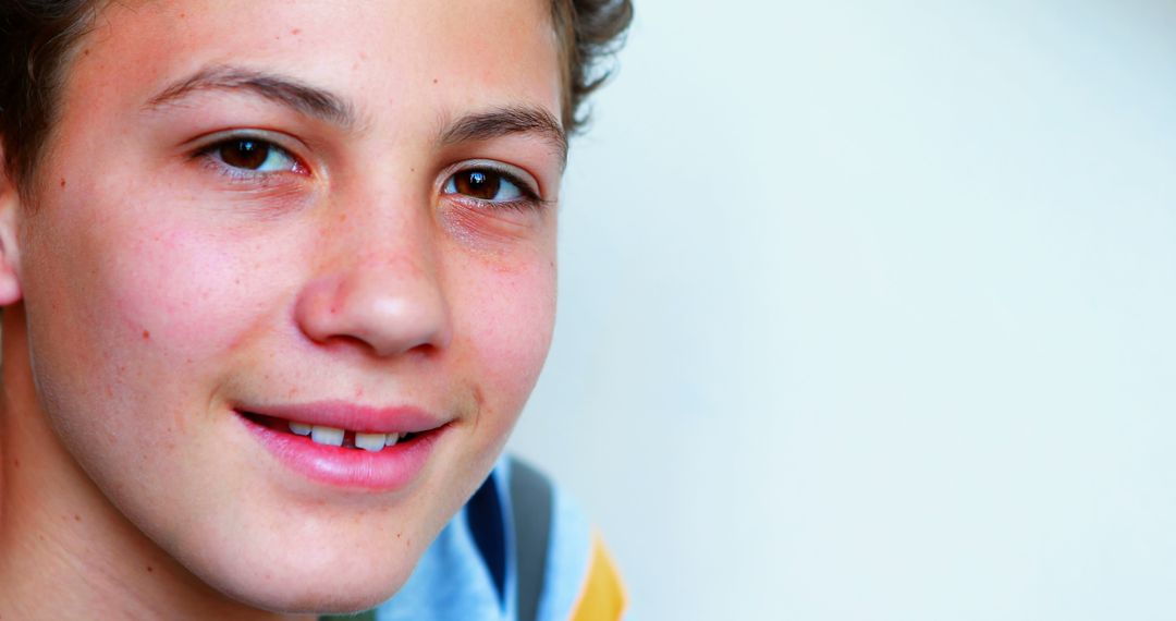 A close-up of a smiling teenage boy with Caucasian features, with copy space - Free Images, Stock Photos and Pictures on Pikwizard.com