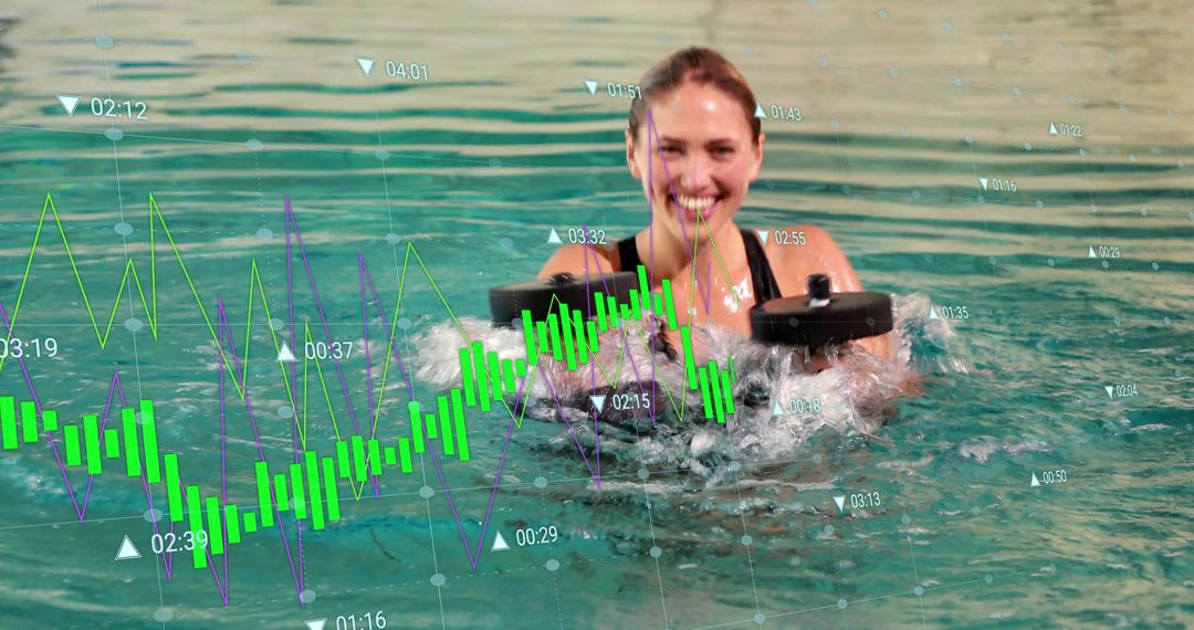 Smiling woman lifting foam dumbbells in pool splashing, augmented data charts floating