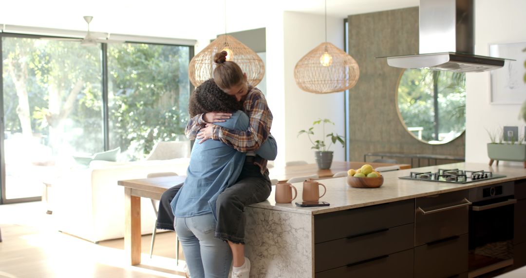 Diverse Friends Embracing in Stylish Modern Kitchen