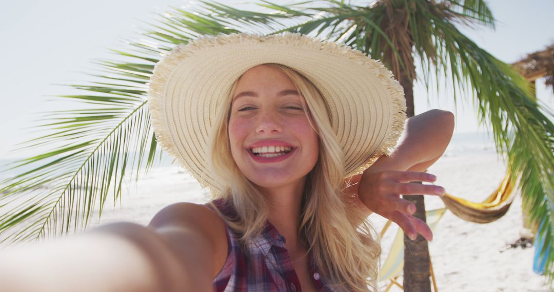 Smiling Woman Taking Selfie on Tropical Beach - Free Images, Stock Photos and Pictures on Pikwizard.com