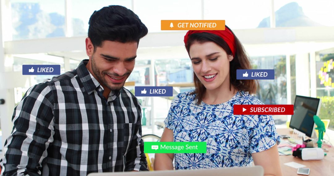 Diverse Colleagues Engaging with Digital Media Icons in Office