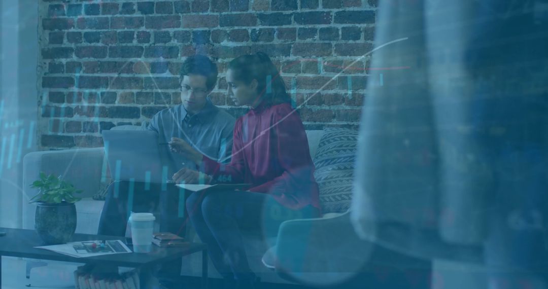 Team Analyzing Financial Data Over Digital Display in Modern Office