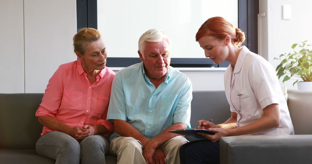 Elderly couple consulting with healthcare professional in modern office - Free Images, Stock Photos and Pictures on Pikwizard.com