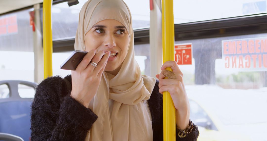 Woman in hijab talking on mobile phone in the bus 4k - Free Images, Stock Photos and Pictures on Pikwizard.com
