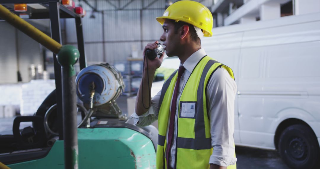 Warehouse Supervisor Using Walkie-Talkie for Communication - Free Images, Stock Photos and Pictures on Pikwizard.com