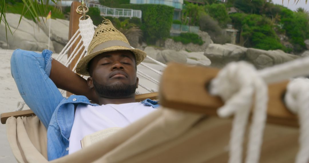 Man Relaxing in Hammock on Beachfront Retreat