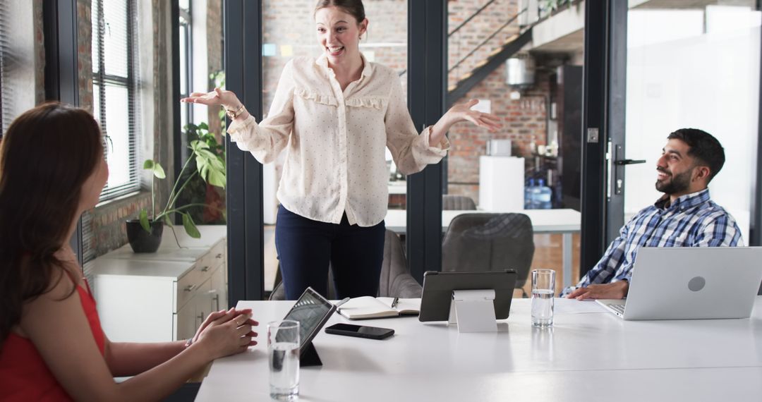 Diverse Team Engaged in Lively Office Discussion