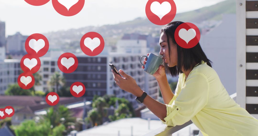 Biracial Woman Engaging with Social Media on Smartphone Relaxing on Balcony