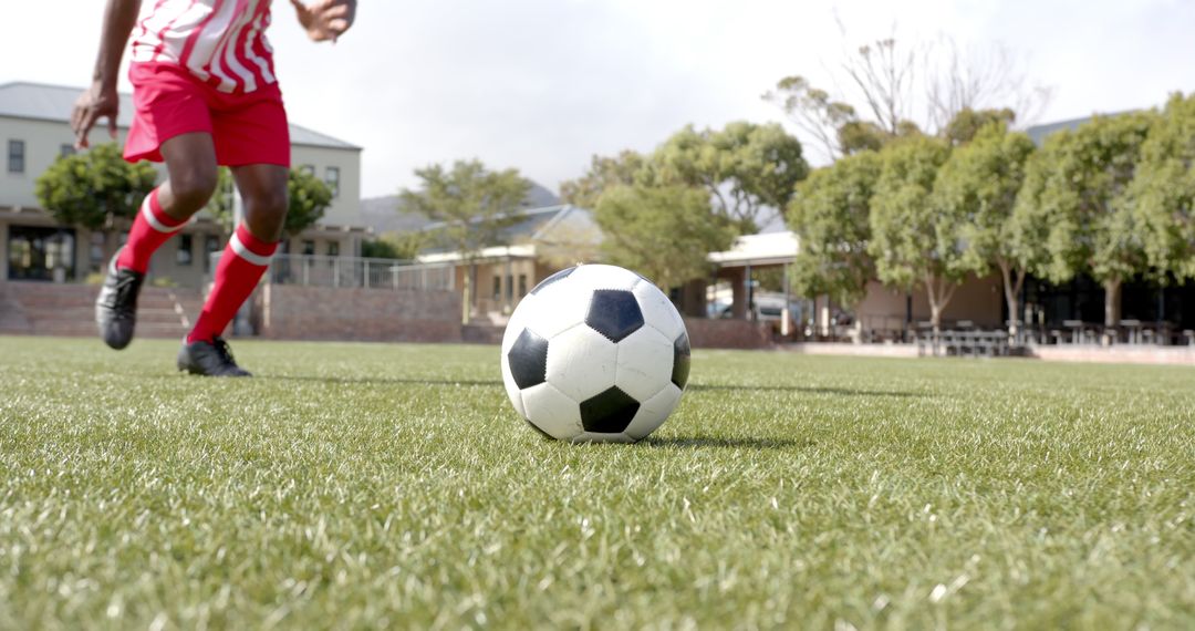 Competitive Soccer Action on Campus Turf with Athlete Ready to Strike