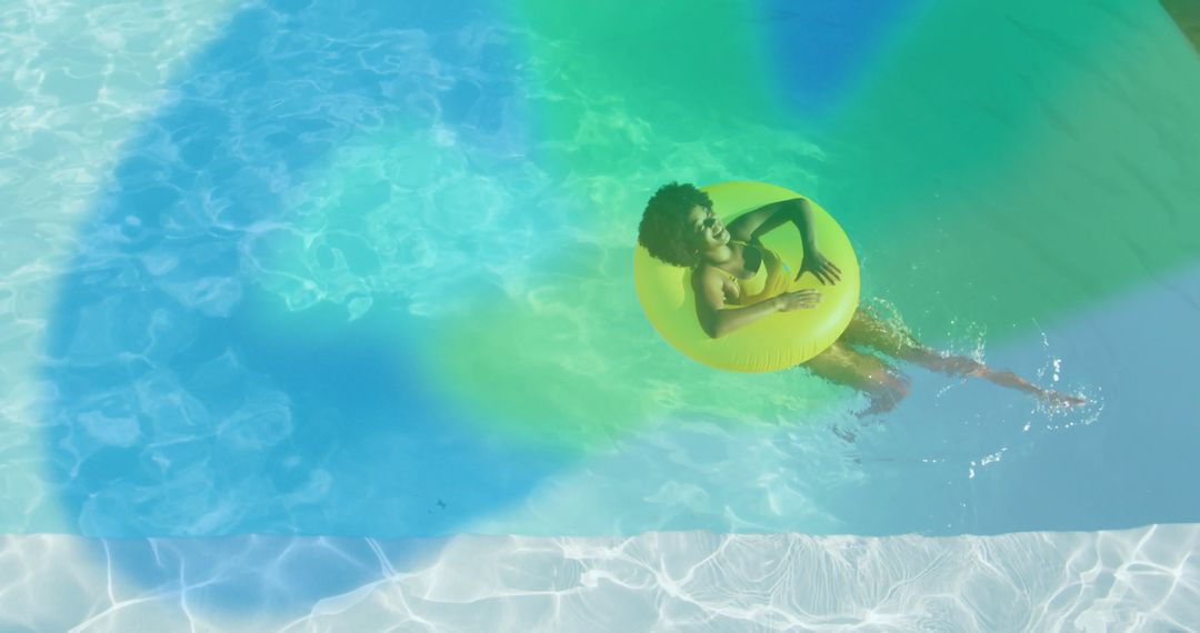 Woman Floating on Yellow Inflatable in Tropical Pool Atmosphere