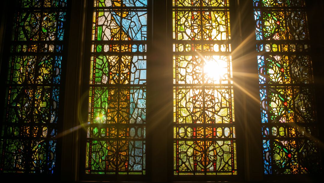 Sunlight Streaming Through Colorful Stained Glass Window