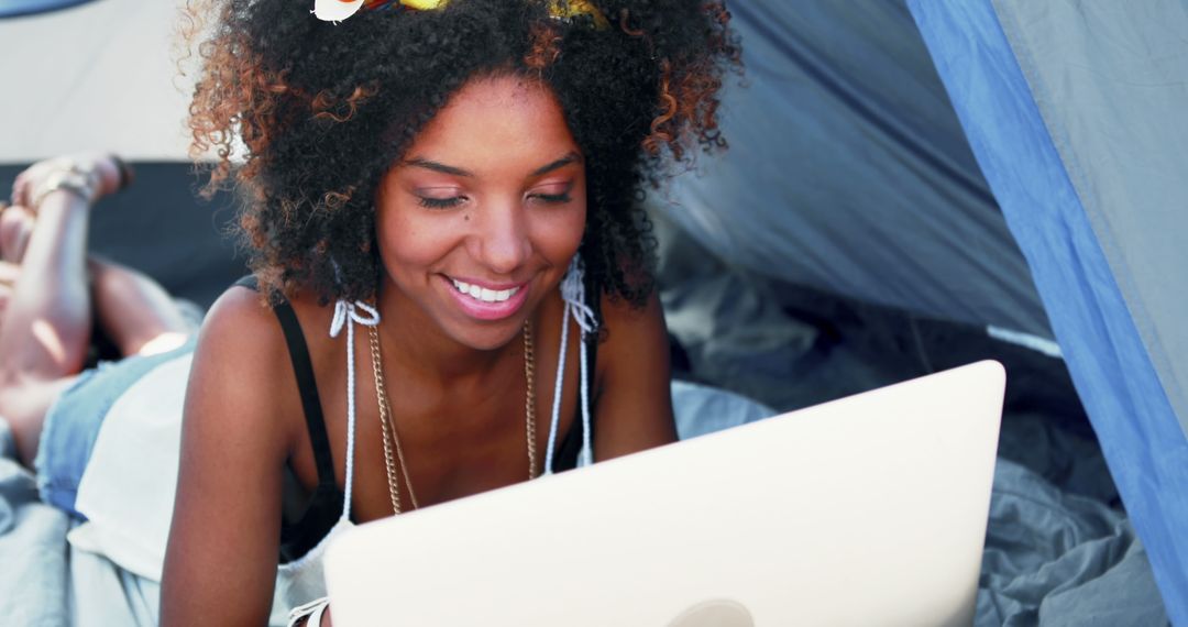 Young Woman Using Laptop in Tent Outdoors - Free Images, Stock Photos and Pictures on Pikwizard.com