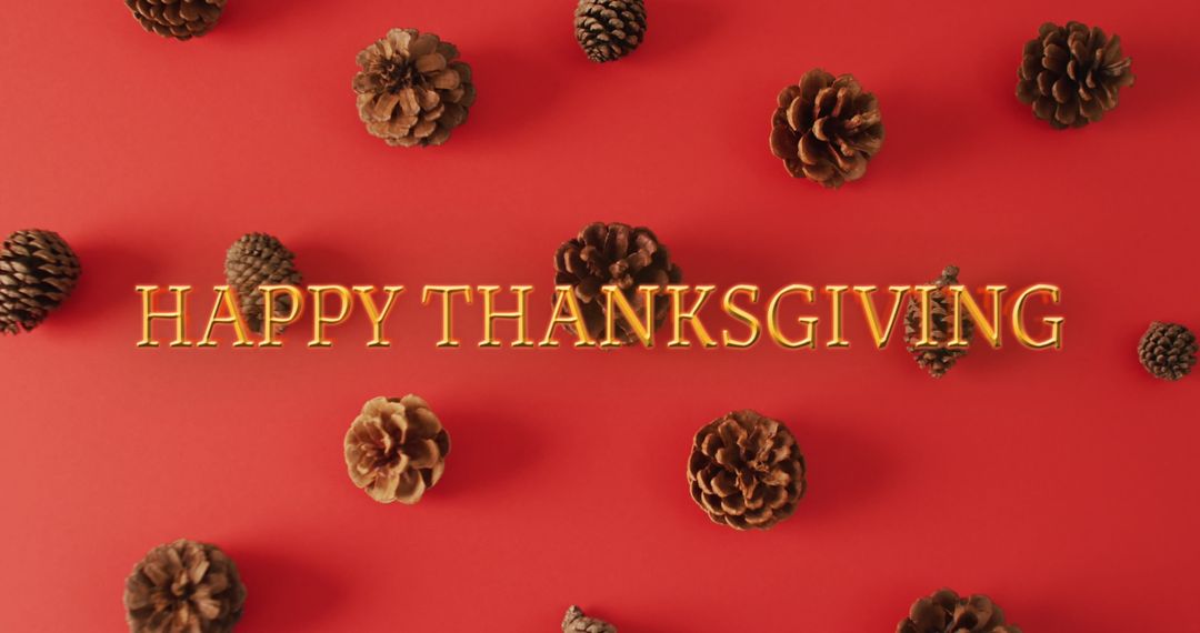 Happy Thanksgiving Text with Pine Cones and Red Background