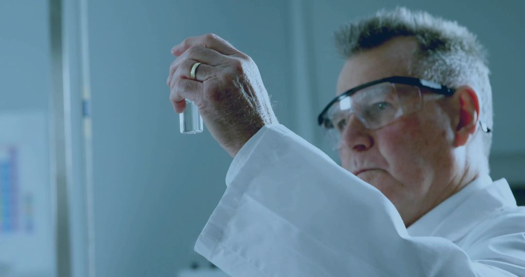 Senior Scientist Analyzing Vial in Modern Laboratory Setting