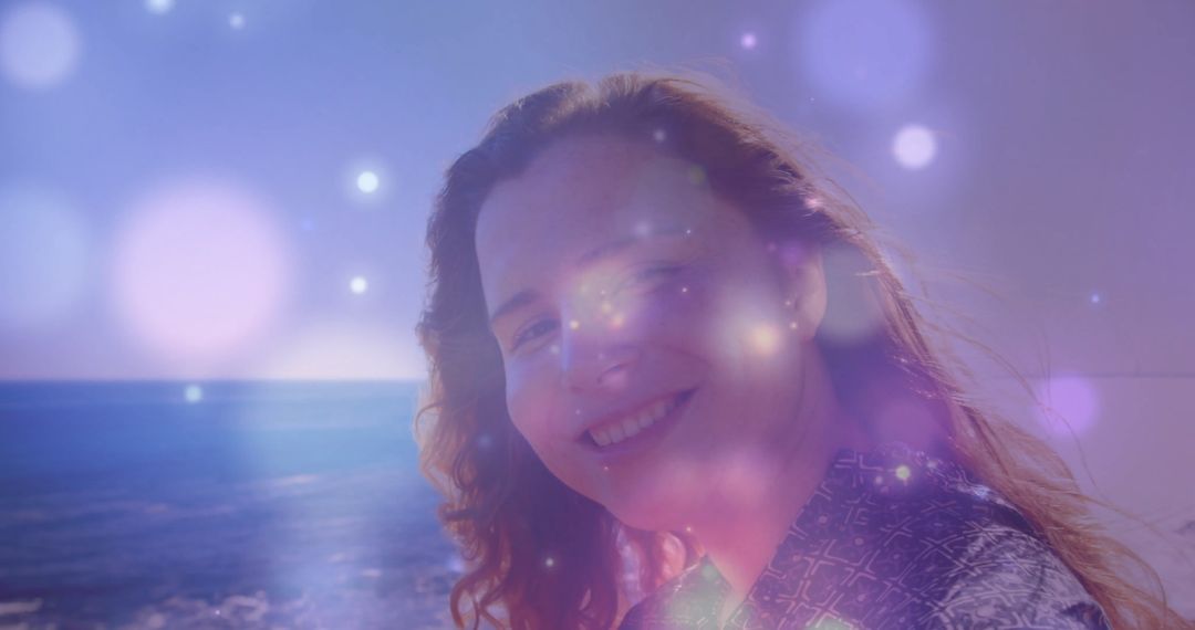 Woman gazing at sea horizon amidst ethereal illumination