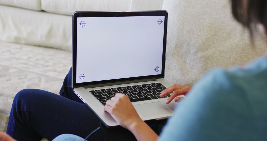 Person Using Laptop with Blank Screen Working from Home - Free Images, Stock Photos and Pictures on Pikwizard.com