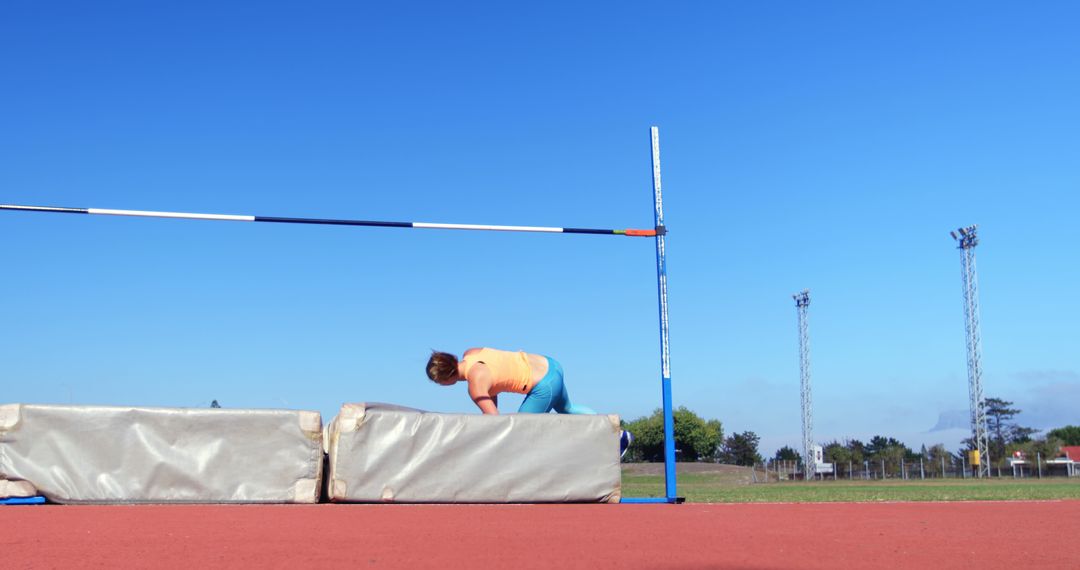 Female Athlete Attempting High Jump on Track and Field - Free Images, Stock Photos and Pictures on Pikwizard.com