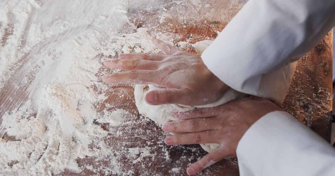 Expert Baker Kneads Dough in Artisan Kitchen - Free Images, Stock Photos and Pictures on Pikwizard.com