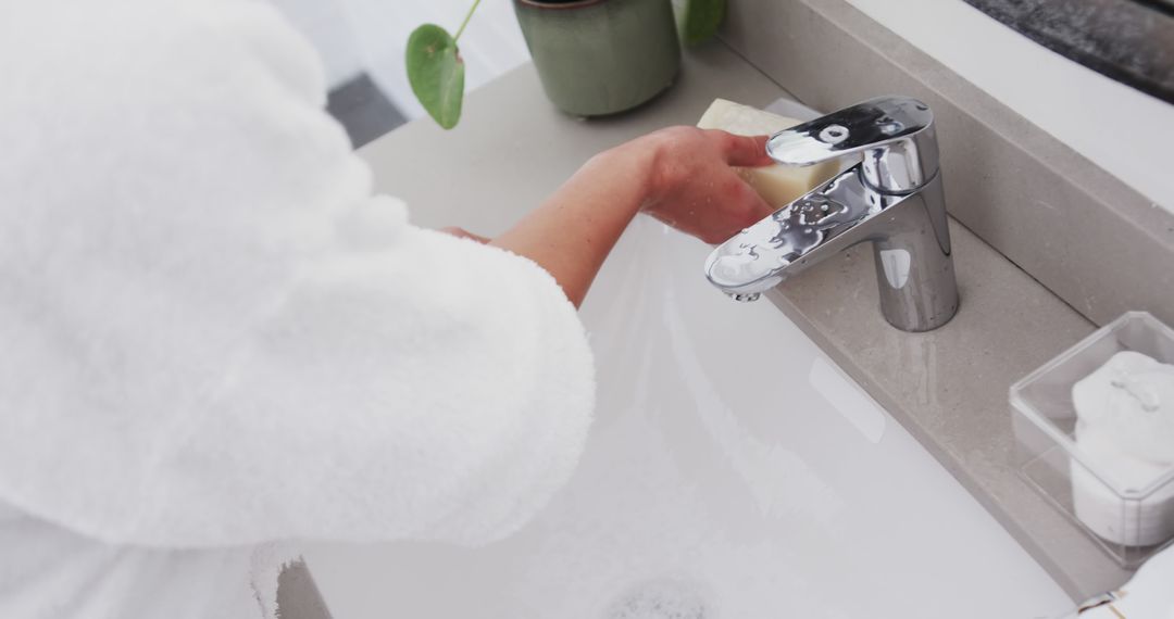 Biracial Woman Washing Hands in Bathroom – Hygiene and Self-care - Free Images, Stock Photos and Pictures on Pikwizard.com