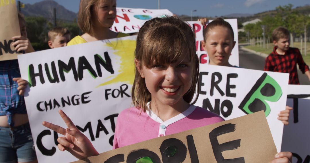 Children Holding Climate Change Protest Signs Outdoors - Free Images, Stock Photos and Pictures on Pikwizard.com