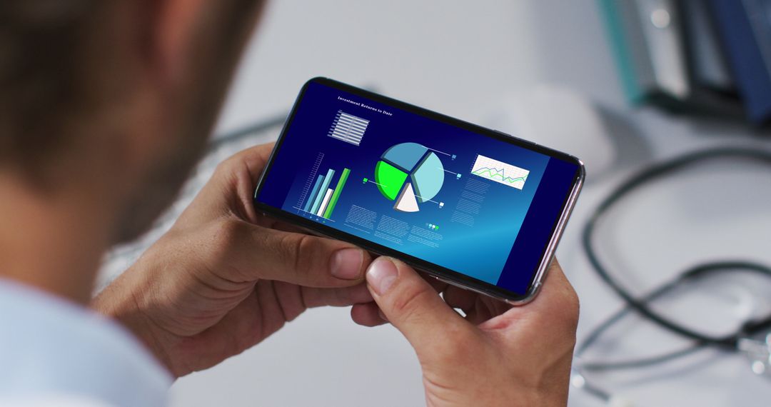 Caucasian Man Analyzing Data Graph on Smartphone Screen