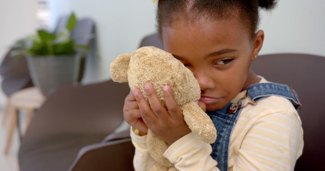 Worried Girl Holding Teddy Bear in Hospital Waiting Room - Free Images, Stock Photos and Pictures on Pikwizard.com