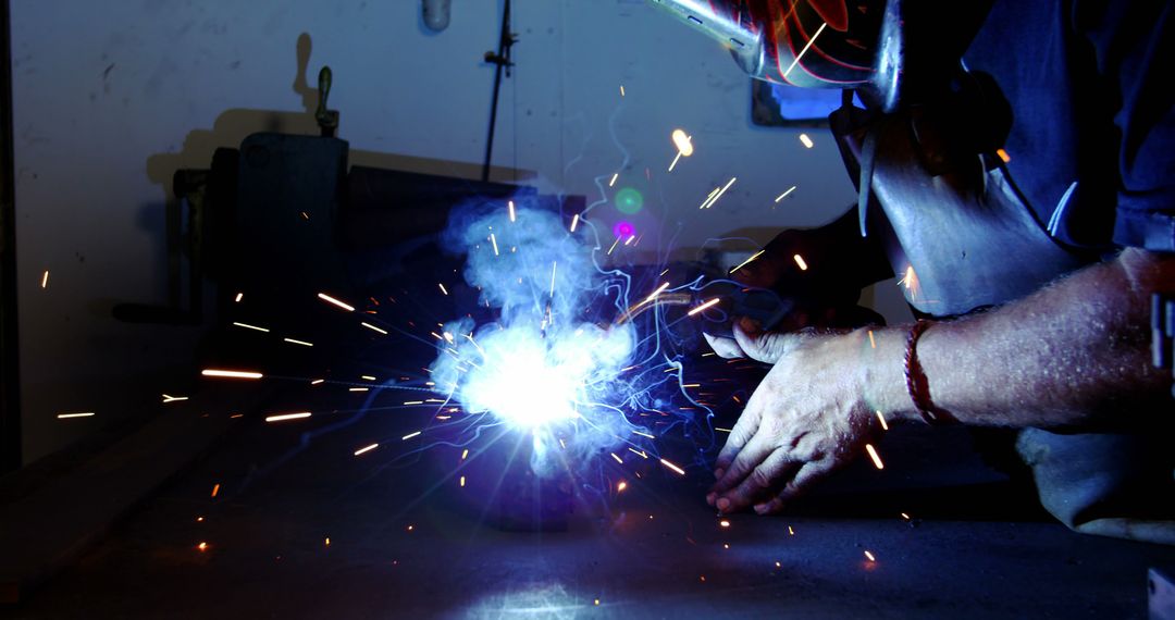 Skilled Worker Welding Metal in Workshop - Free Images, Stock Photos and Pictures on Pikwizard.com