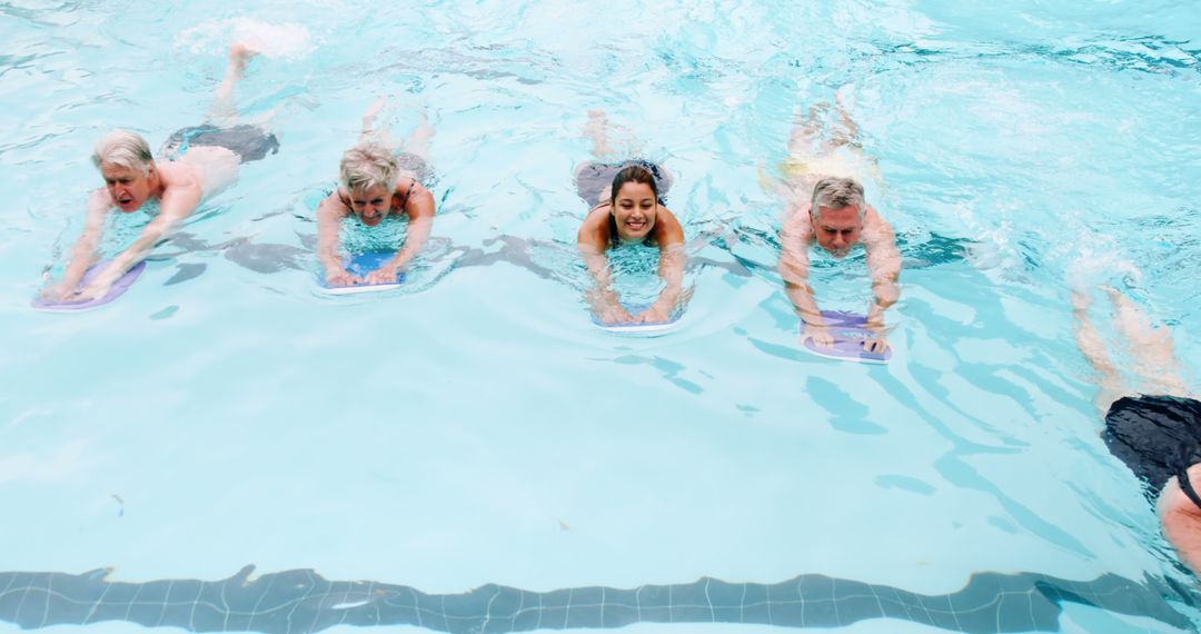 Group of Senior Citizens and Young Woman Taking Swimming Lesson - Free Images, Stock Photos and Pictures on Pikwizard.com