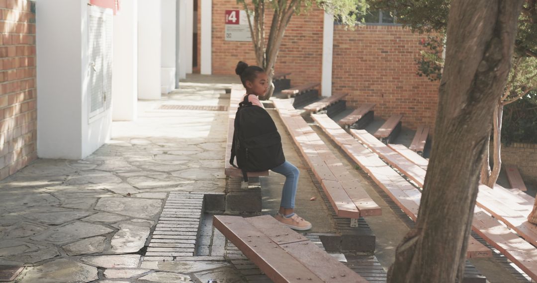 Child Waiting for Class Outside School Building