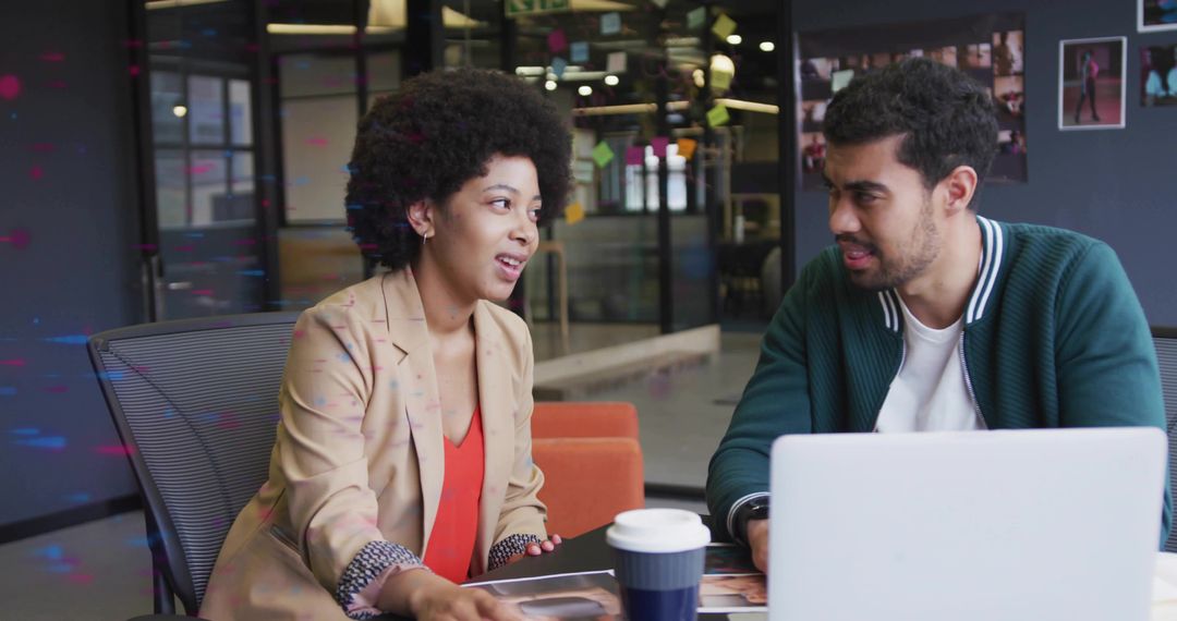 Colleagues Engaged in Creative Brainstorming Session in Modern Office