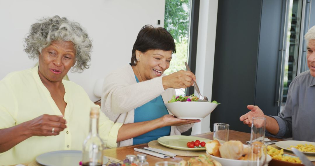 Senior Friends Enjoying a Healthy Meal Together at Home - Free Images, Stock Photos and Pictures on Pikwizard.com