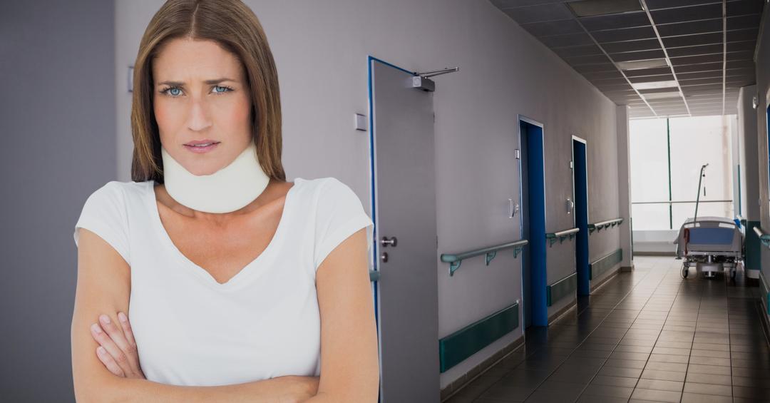 Portrait of woman standing with arms crossed in hospital corridor - Free Images, Stock Photos and Pictures on Pikwizard.com