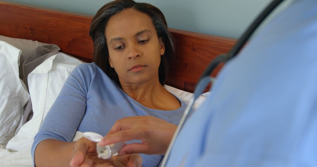 Female Patient Receiving Medical Assistance from Doctor at Home - Free Images, Stock Photos and Pictures on Pikwizard.com