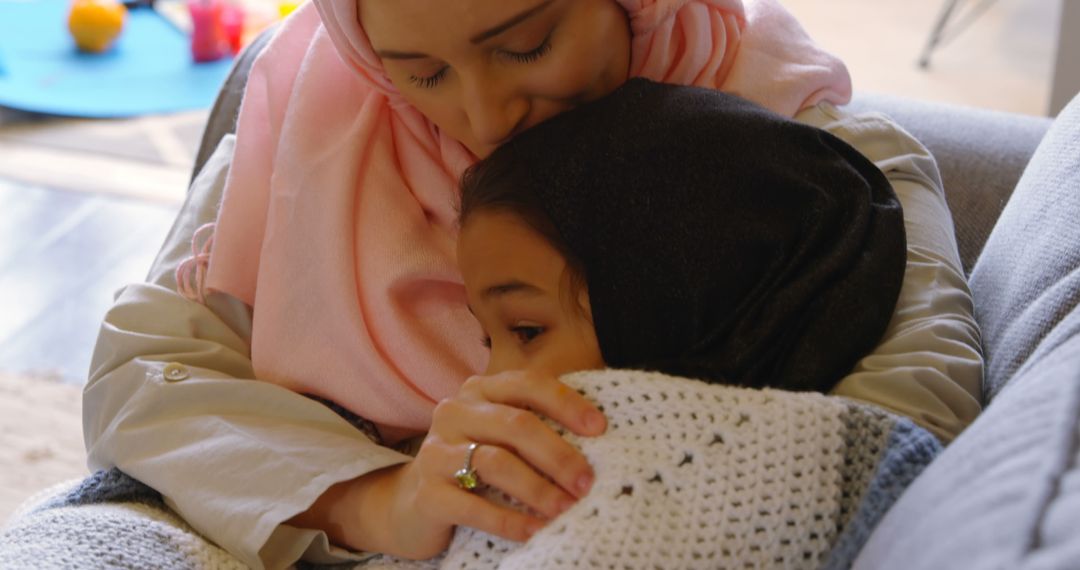 Mother Comforting Child on Couch - Free Images, Stock Photos and Pictures on Pikwizard.com