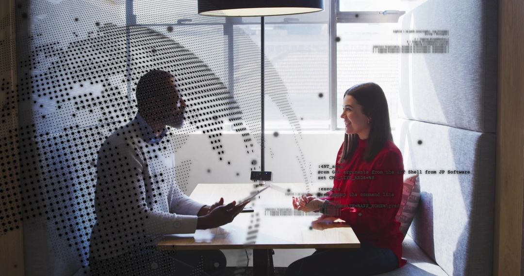 Two Colleagues Collaborating in Modern Meeting Space with Digital Elements