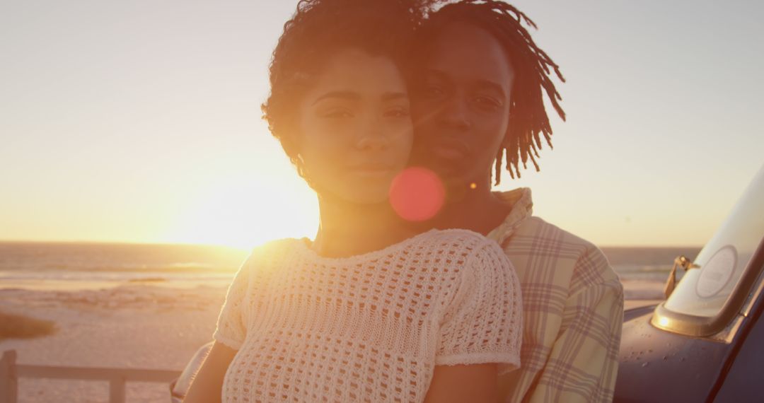 Romantic Couple Embracing at Sunset on Beach - Free Images, Stock Photos and Pictures on Pikwizard.com