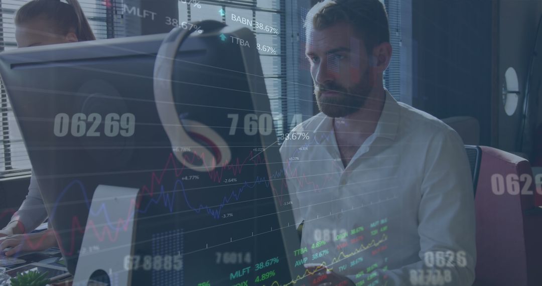 Businessman Analyzing Stock Market Data on Computer in Modern Office
