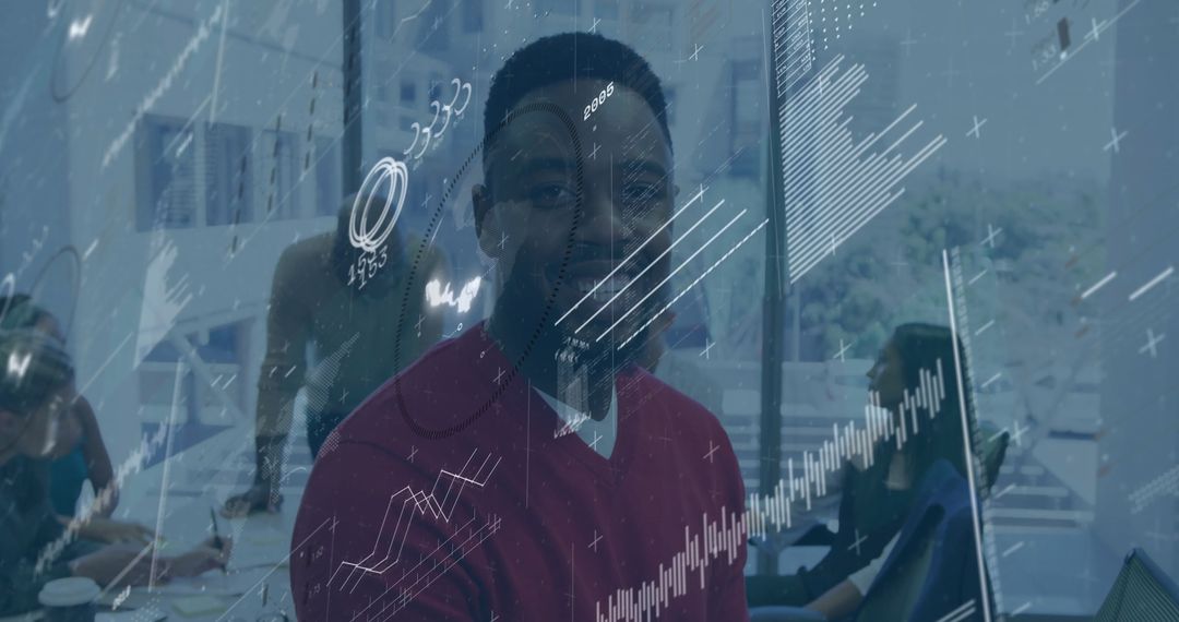 Smiling Professional with Financial Data Visualization in Office