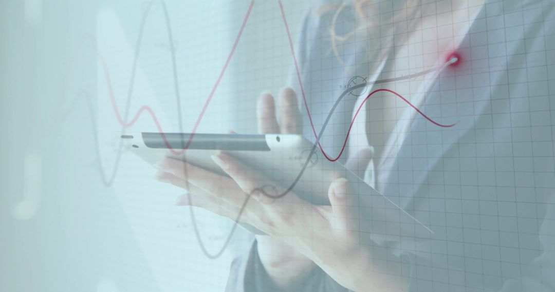 Business Professional Analyzing Data on Tablet with Graphs