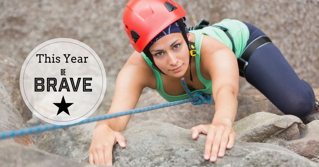 Brave female climber focused on rock climbing challenge