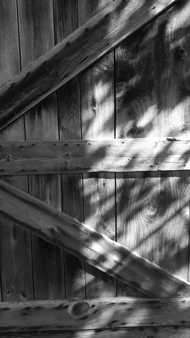 Weathered Wooden Fence with Sunlight and Shadows - Free Images, Stock Photos and Pictures on Pikwizard.com