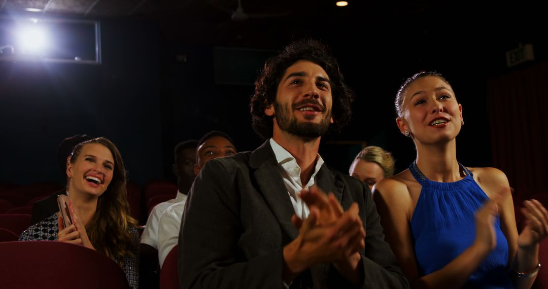 Diverse Group of Enthusiastic Young Adults Applauding in Theater