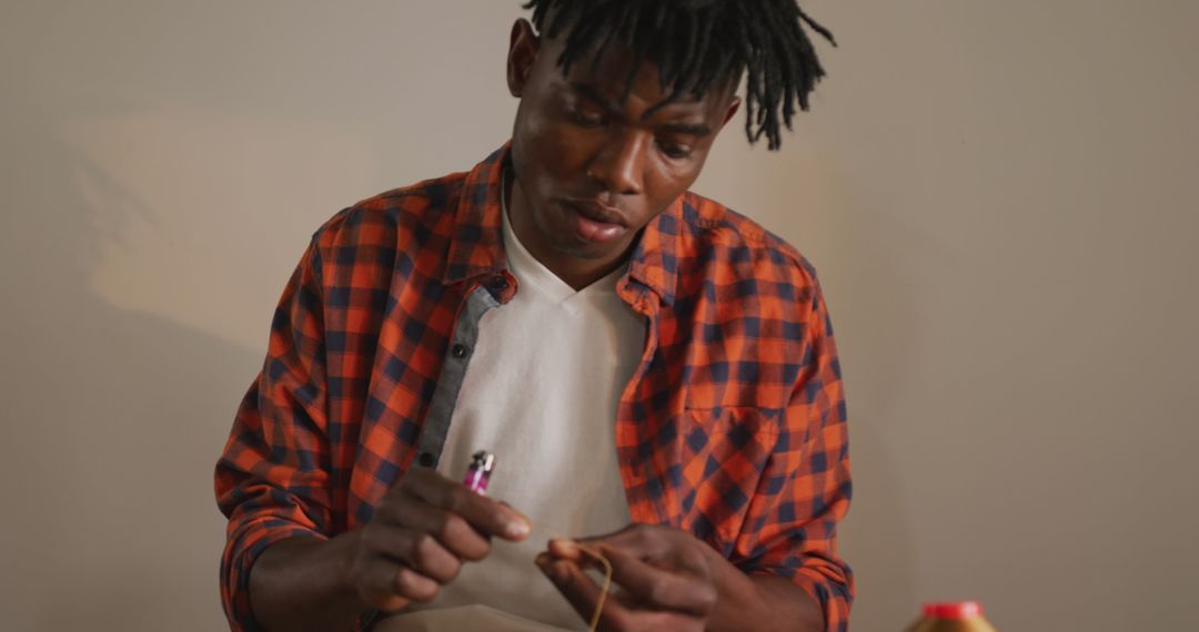 African American Craftsman Precision Working in Leather Workshop