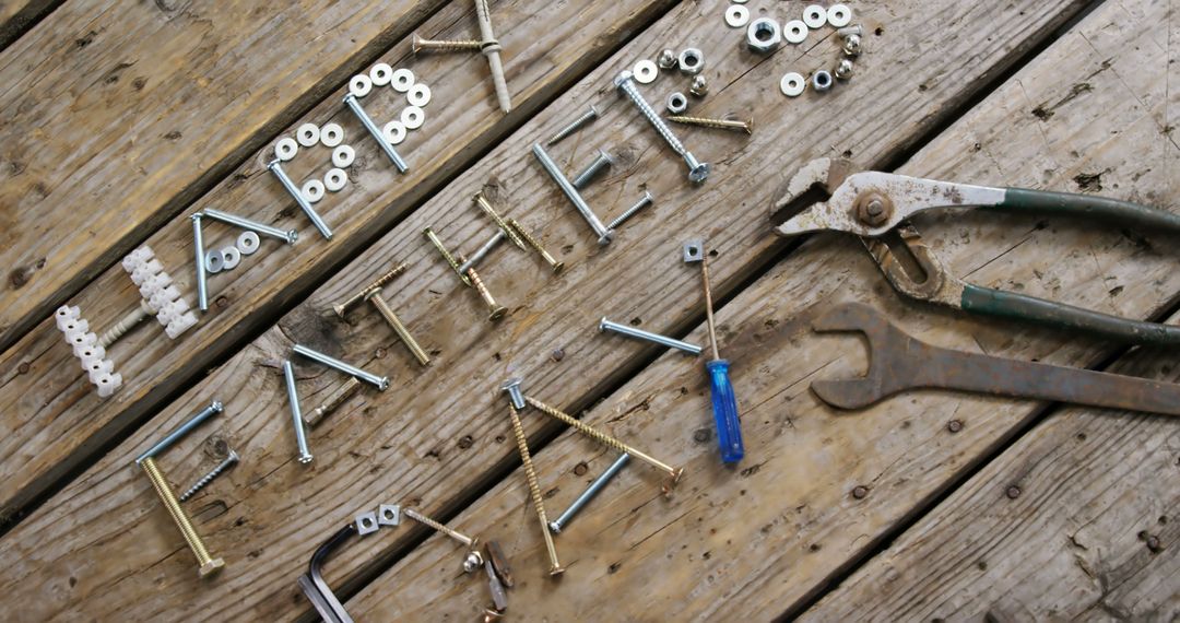 Happy Father's Day message made from tools on wooden surface - Free Images, Stock Photos and Pictures on Pikwizard.com
