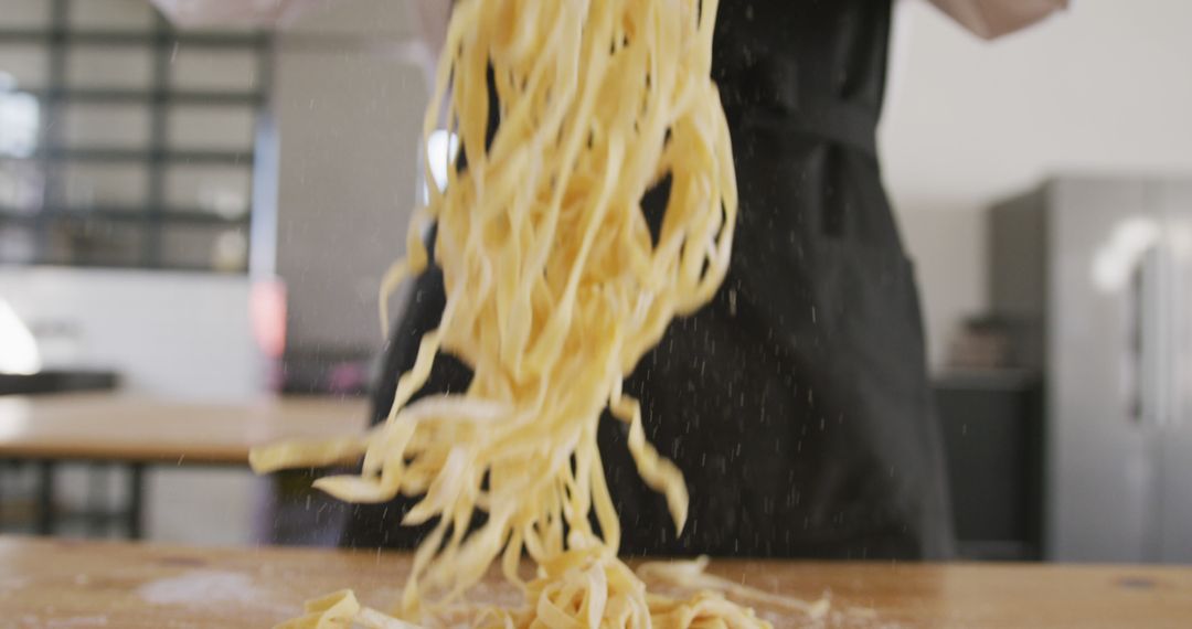 Chef Throwing Freshly Made Pasta in Kitchen - Free Images, Stock Photos and Pictures on Pikwizard.com